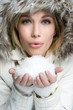 Girl Blowing Snow
