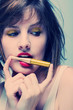 Portrait of a woman with red lipstick and gold make-up Portrait of a woman with red lipstick and gold make-up