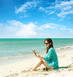 Girl reading a book near the sea Girl reading a book near the sea