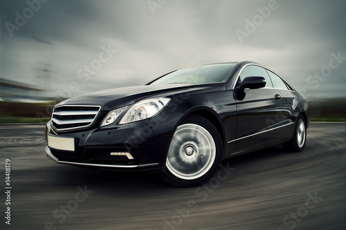 Photo: Car driving fast Car driving fast