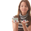 Young woman with two hose models in hands