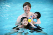 Photo: Father and children in pool Father and children in pool