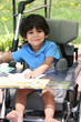 Photo: Disabled child in medical stroller Disabled child in medical stroller