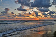 Sunset with clouds and reflections on the water