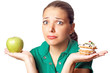 Young pretty woman. Dilema. Apple or cake. Health or tasty.