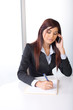 Business woman on a cell phone in a modern office Business woman on a cell phone in a modern office