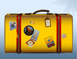 vintage yellow suitcase with stickers