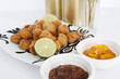 Caribbean breaded conch fitters, hot jerky sauce and cold beer