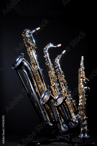 Four Saxophones on black