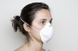 Girl with a mask against swine flu