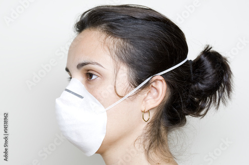 Photo: Latin Girl wit a mask against swine flu Latin Girl wit a mask against swine flu