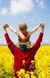 father with daughter on the rape field