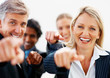 Successful team of business colleagues pointing