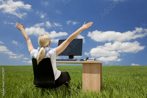 Photo: Businesswoman Using Computer In A Green Field Businesswoman Using Computer In A Green Field