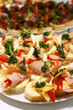 Small sandwiches with meat and cheese