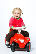Girl Riding Toy Car