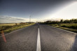 Country Asphalt road in strong flare Country Asphalt road in strong flare