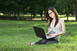 student with laptop outdoors