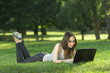 student with laptop outdoors