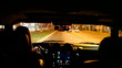 Timelapse of a Woman Driving Through the City at Night