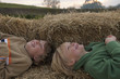 Two boys on hay bales Two boys on hay bales