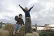 Young boys on hay bales Young boys on hay bales