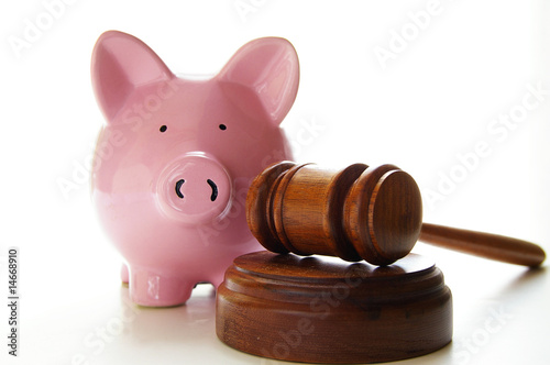 Photo: judges court gavel and piggy bank, on white judges court gavel and piggy bank, on white