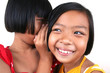 Two young asian kids whispering. Two young asian kids whispering.
