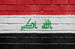 Flag of Iraq on brick wall