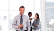 Happy businessman in the office with his team