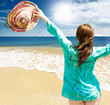Happy girl on the beach against blue sea Happy girl on the beach against blue sea