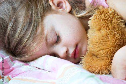 Photo: Toddler sleeping with her teddy bear Toddler sleeping with her teddy bear