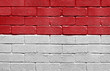 Flag of Monaco on brick wall
