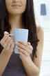 Photo: Woman holding tea cup Woman holding tea cup