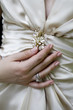 Women hands on wedding dress