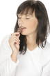 Young woman eating chocolate