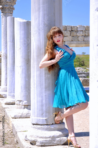 Photo: Young fashion model standing close to the Ancient Ruins Young fashion model standing close to the Ancient Ruins