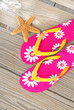 Flip flops and starfish on dock Flip flops and starfish on dock