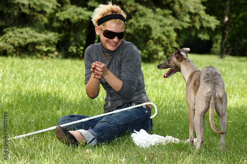 Photo: blind woman playing with her dog blind woman playing with her dog