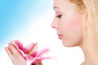 Beauty blonde spa girl with pink lily Beauty blonde spa girl with pink lily