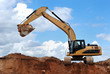 excavator with raised bucket