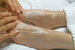 REFLEXOLOGY - applying cream prior to treatment