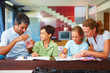 Parents assiting their children to do schoolwork
