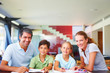 Parents helping their children with their schoolwork