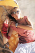 An attractive woman in sunglasses on the beach