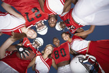 Photo: Football Players and cheerleaders in Huddle, view from below, view from below Football Players and cheerleaders in Huddle, view from below, view from below