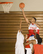 Basketballer performing lay-up in match