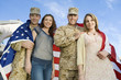 Military couples embracing outdoors, portrait