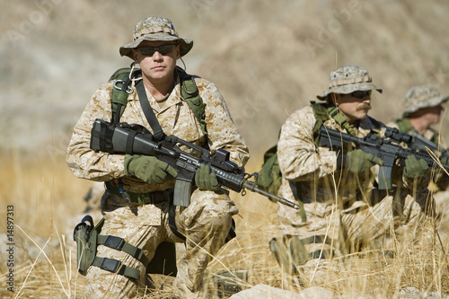 Photo: Soldiers with rifles in field Soldiers with rifles in field