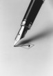 Tip of fountain pen marking checkbox, b&w, close-up